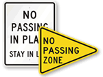 yellow and black no passing zone sign