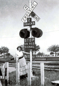 1955 crossbuck sign at train tracks