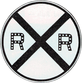 A railroad crossing sign with Cataphotes