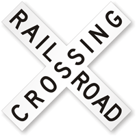 Black and white crossbuck railroad crossing sign