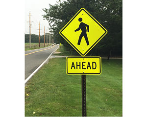 Use a slow pedestrian crossing (with graphic) sign to make a difference  in your community. Signs build awareness and create a safe environment. - A