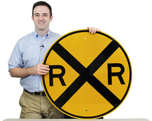 Round railroad crossing sign