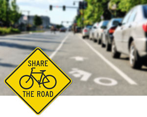 Share the road bike sign