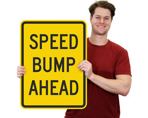 Speed bump ahead sign
