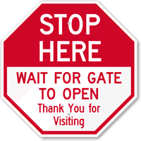 Stop Here Wait For Gate To Open Sign