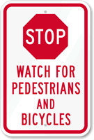 Stop - Watch For Pedestrians And Bicycles Sign