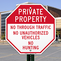 No Unauthorized Vehicles & No Hunting Sign