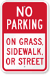 No Parking On Grass, Sidewalk, Or Street Sign