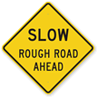 Rough Road Ahead Slow Sign