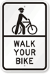 Walk Your Bike Sign with Cyclists Wearing Helmet