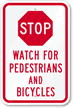 Stop - Watch For Pedestrians And Bicycles Sign
