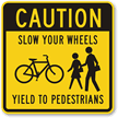 Caution: Yield to Pedestrians Safety Sign