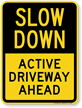 Active Driveway Ahead Slow Down Sign