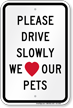 Drive Slowly We Love Our Pets Sign