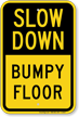 Slow Down Bumpy Floor Sign