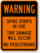 Spike Strips In Use Tire Damage Sign