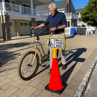 Walk your bike cone sign