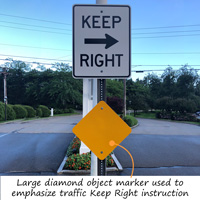Large yellow reflector, diamond shaped sign