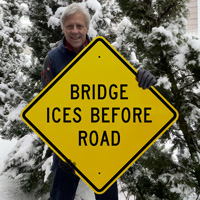 Bridge ices before road sign